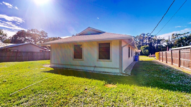 back of house with a yard