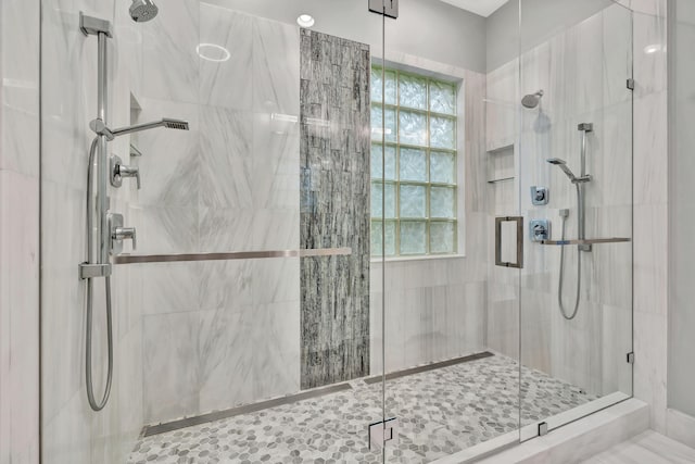 bathroom with a shower stall