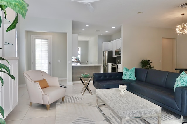 living room featuring visible vents, baseboards, light tile patterned floors, an inviting chandelier, and recessed lighting