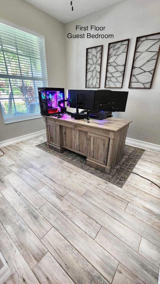 office featuring light wood finished floors and baseboards