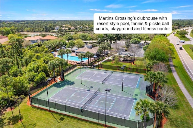 view of sport court featuring fence