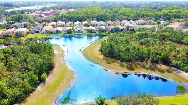 bird's eye view featuring a water view and a residential view