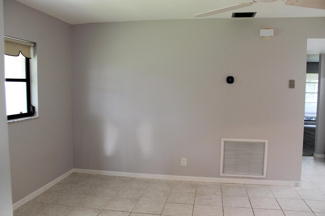 hall featuring baseboards and light colored carpet