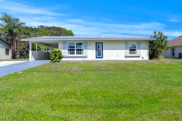 ranch-style home with a front lawn and a carport