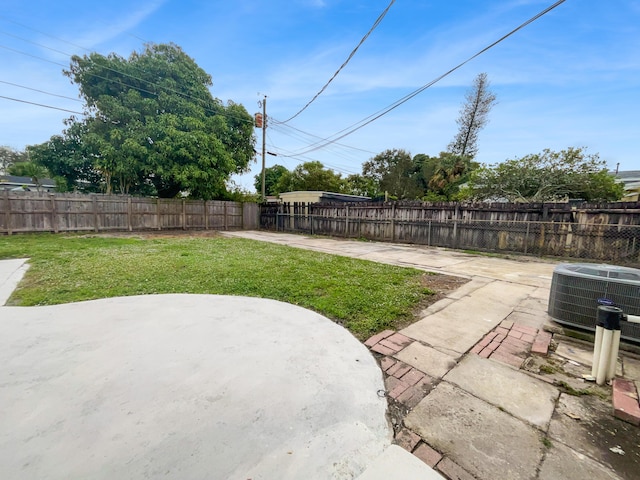 view of yard with a patio area and cooling unit