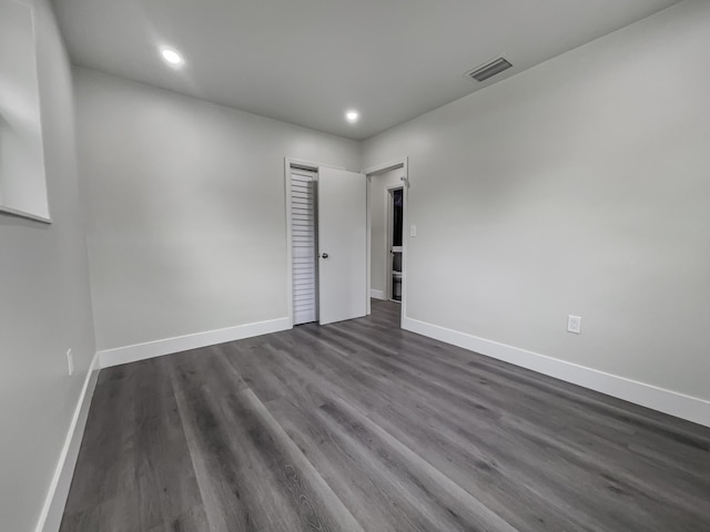 empty room featuring dark hardwood / wood-style floors