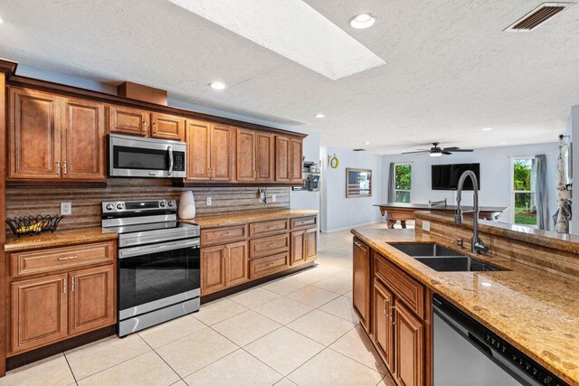 dining room featuring a notable chandelier, light tile patterned floors, lofted ceiling, and visible vents