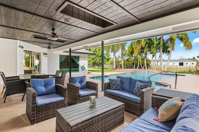 view of patio with fence, an outdoor hangout area, ceiling fan, and a fenced in pool