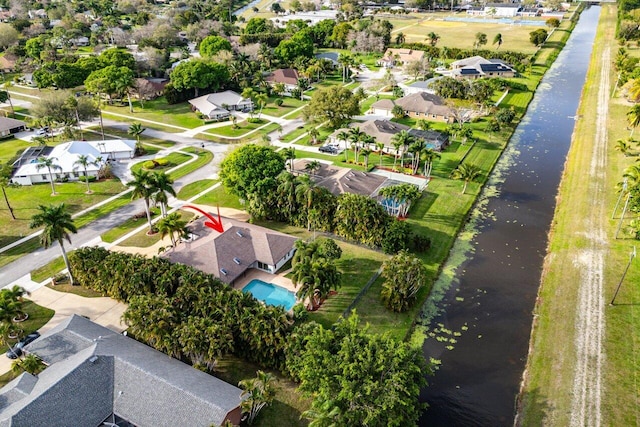 bird's eye view with a water view and a residential view