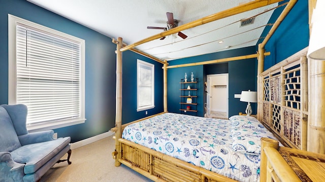 bedroom with ceiling fan and carpet floors