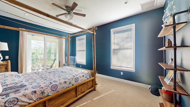 bedroom featuring a textured ceiling, access to exterior, light colored carpet, and ceiling fan