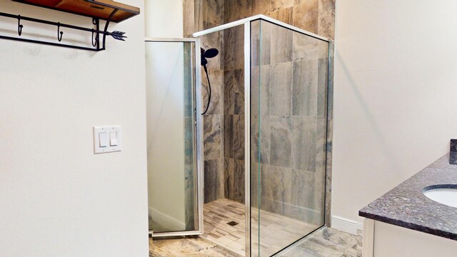 bathroom with vanity and walk in shower