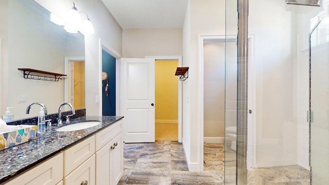 bathroom featuring vanity and walk in shower