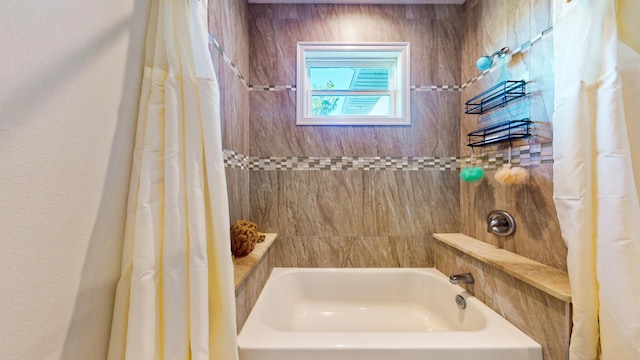 bathroom with shower / tub combo with curtain