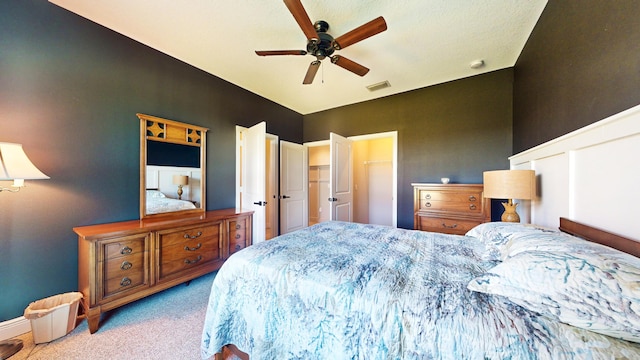 bedroom featuring light carpet and ceiling fan