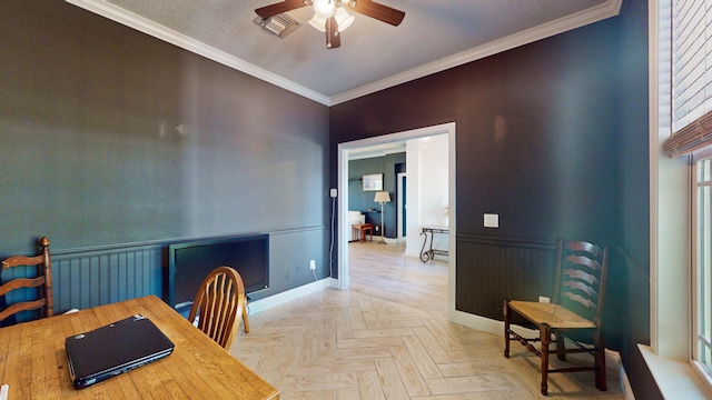 dining room with ceiling fan, light parquet flooring, crown molding, and a textured ceiling