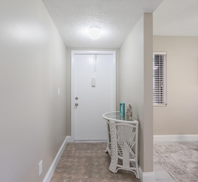 entryway featuring a textured ceiling