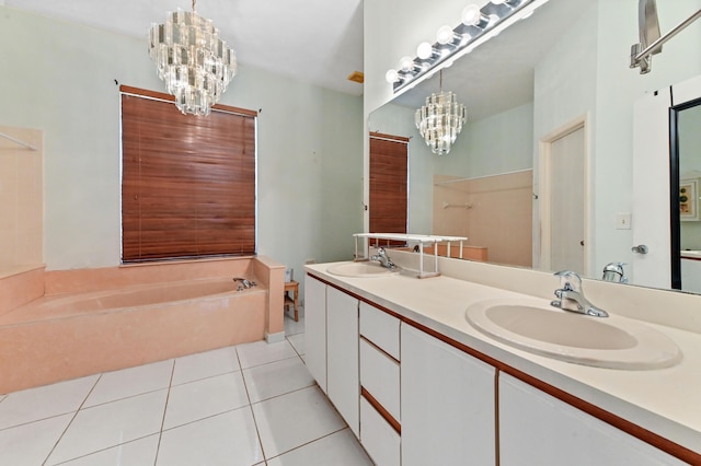 bathroom featuring tile patterned flooring, a sink, a bath, and a notable chandelier