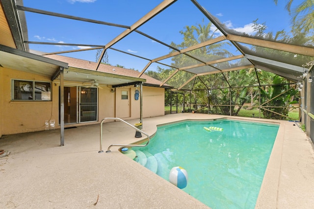 outdoor pool featuring a lanai, ceiling fan, and a patio