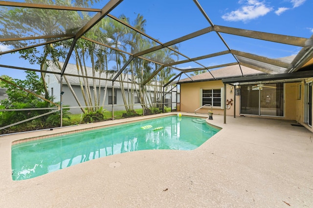 pool featuring a lanai and a patio area