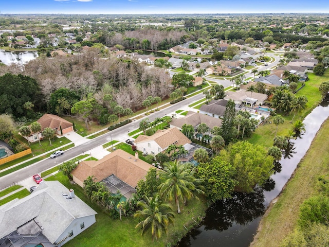 bird's eye view featuring a water view and a residential view