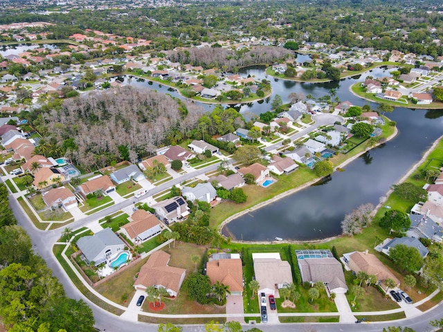 aerial view with a water view and a residential view