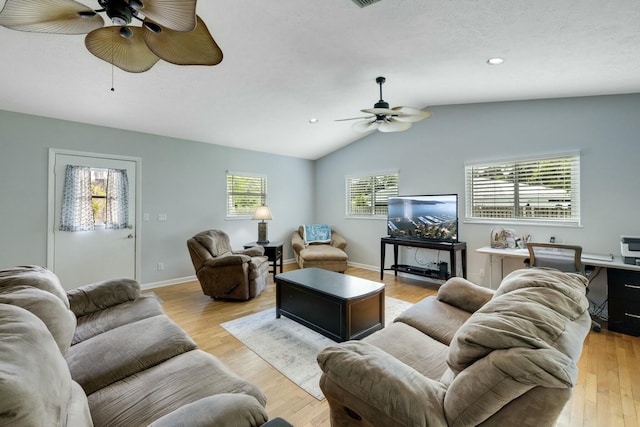 2103 SE Meadowbrook Rd, Stuart, FL 34997 - living room featuring light wood-style flooring, vaulted ceiling, baseboards, and ceiling fan