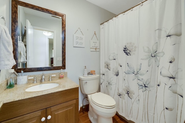 2103 SE Meadowbrook Rd, Stuart, FL 34997 - bathroom with toilet, vanity, and a shower with curtain