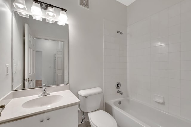 bathroom featuring visible vents, vanity, shower / bathtub combination, and toilet