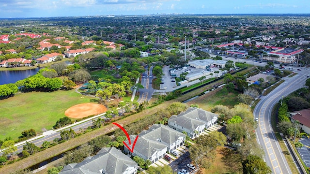 aerial view featuring a water view and a residential view