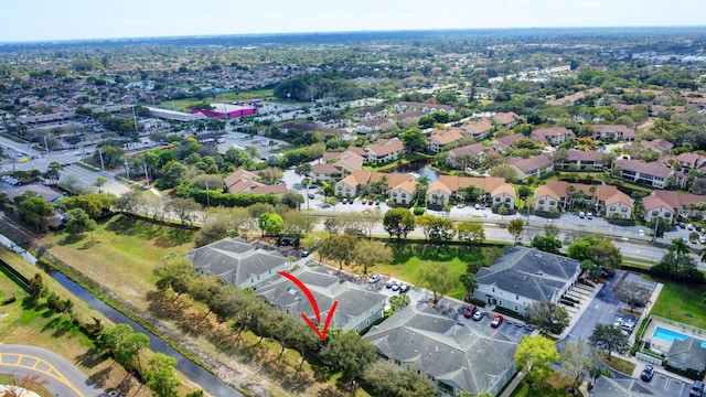 birds eye view of property with a residential view