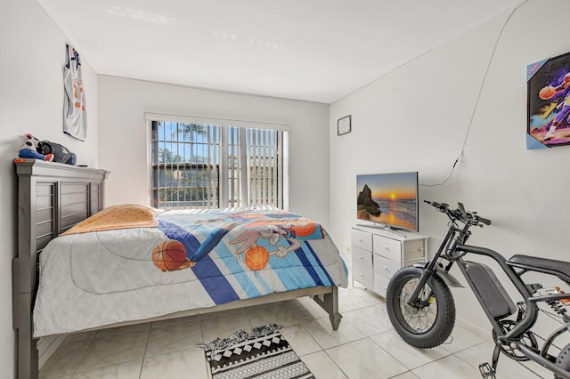 bedroom with light tile patterned floors