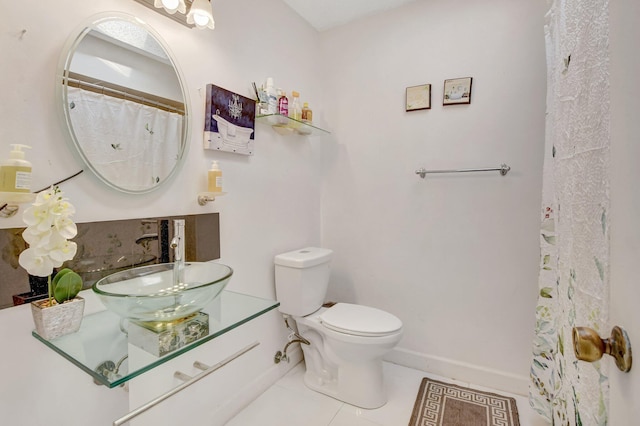 full bathroom with tile patterned flooring, baseboards, vanity, and toilet