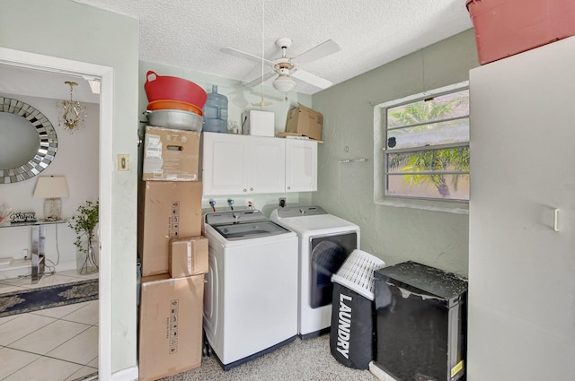 clothes washing area with cabinet space, a ceiling fan, a textured ceiling, and independent washer and dryer