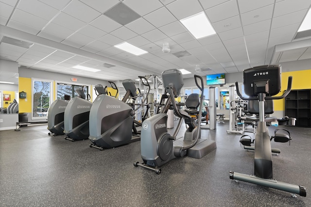 workout area with a paneled ceiling