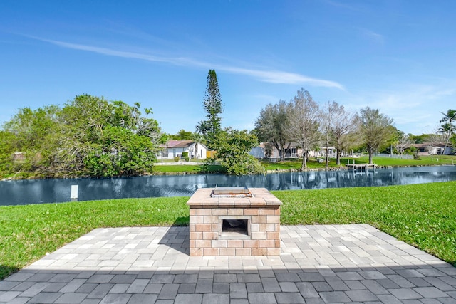 view of patio featuring a fire pit and a water view