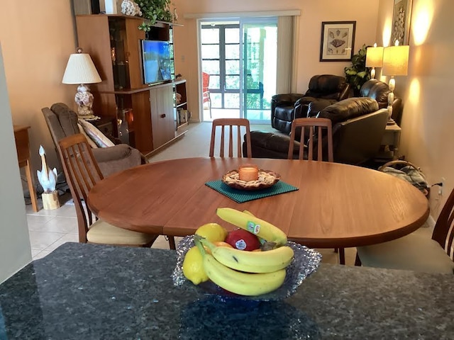 dining space with light tile patterned floors