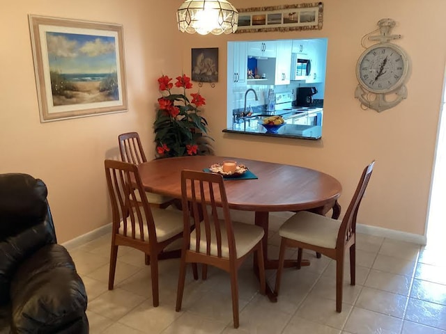 tiled dining area with sink