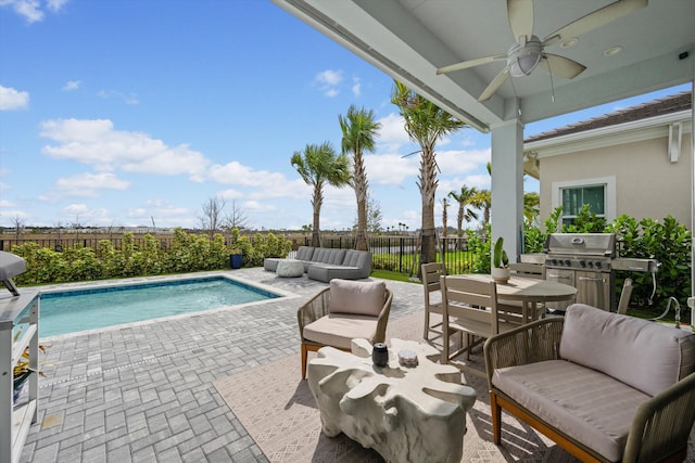 view of swimming pool with a ceiling fan, a fenced in pool, an outdoor hangout area, a patio area, and a fenced backyard