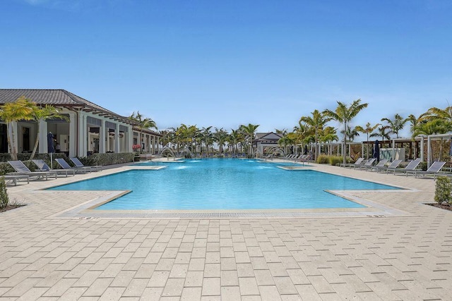 community pool featuring a patio area