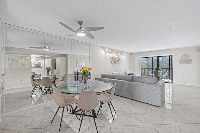 dining area featuring a textured ceiling