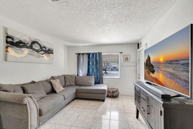 living room with light tile patterned floors and a textured ceiling