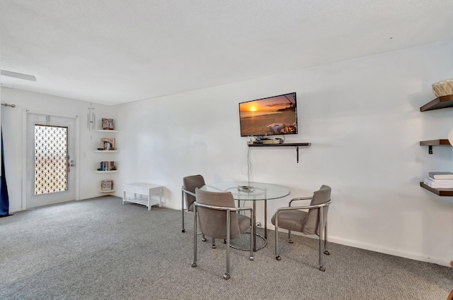 dining room with carpet and baseboards