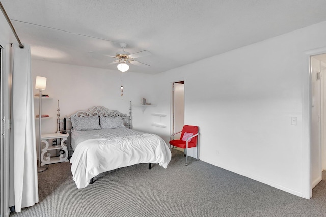 bedroom featuring ceiling fan and carpet floors