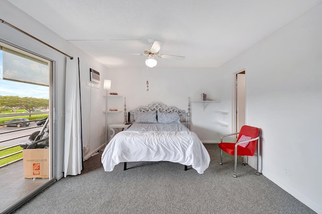 carpeted bedroom with a ceiling fan, baseboards, and a wall mounted AC