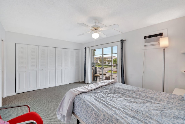 bedroom featuring a ceiling fan, access to exterior, a textured ceiling, an AC wall unit, and carpet floors