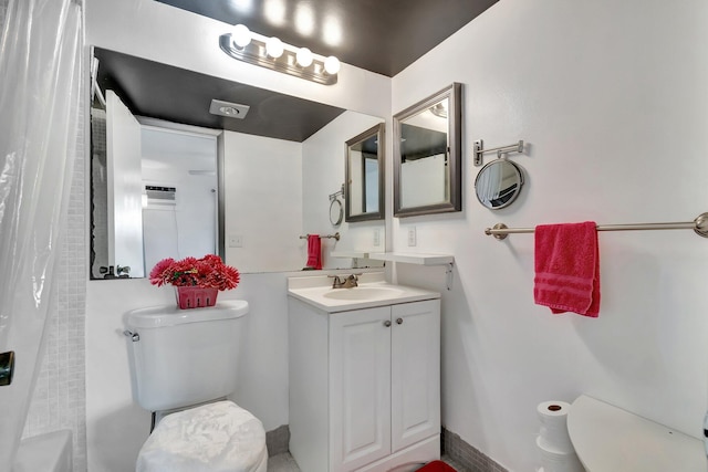 bathroom with vanity and toilet