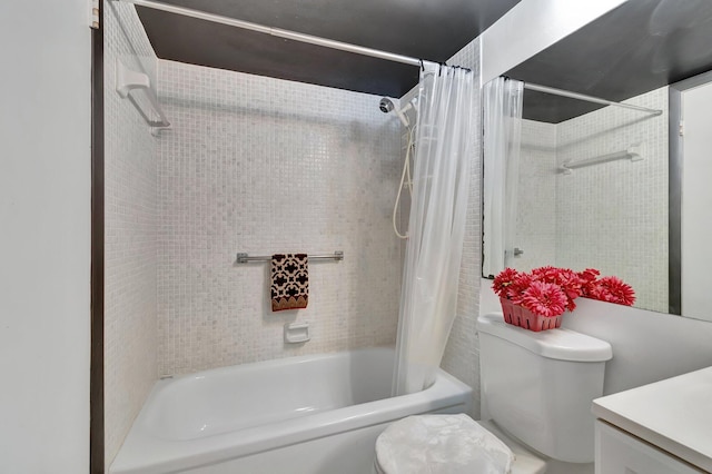 full bath with vanity, toilet, and shower / bath combo with shower curtain