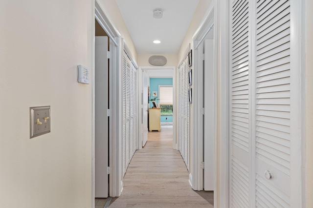 hallway with light wood finished floors