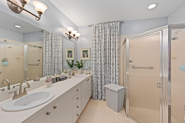 bathroom featuring a stall shower and a sink